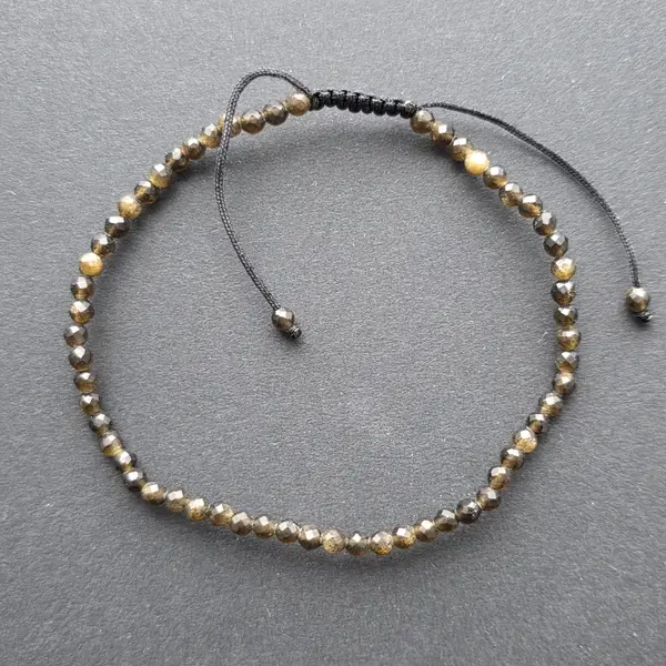 Bratara fatetata obsidian auriu 3 mm snur reglabil